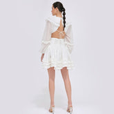 Tiered ruffle mini dress in sheer organza with balloon sleeves and open back tie detail